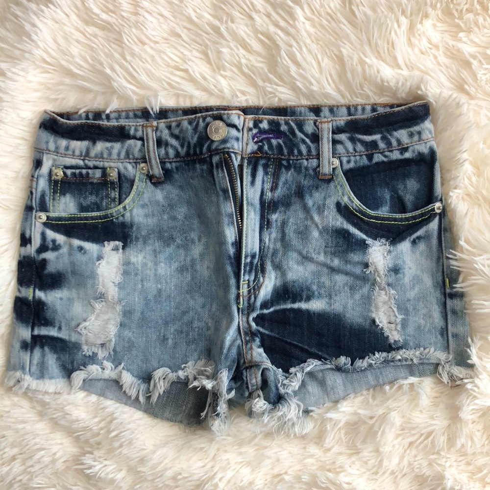 Jalate Jean shorts with neon and purple sewing along the seams.
